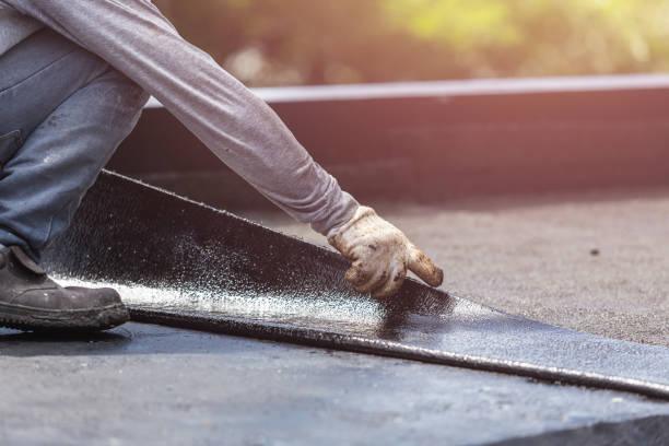 Professional Basement Waterproofing technician working in Arlington, GA